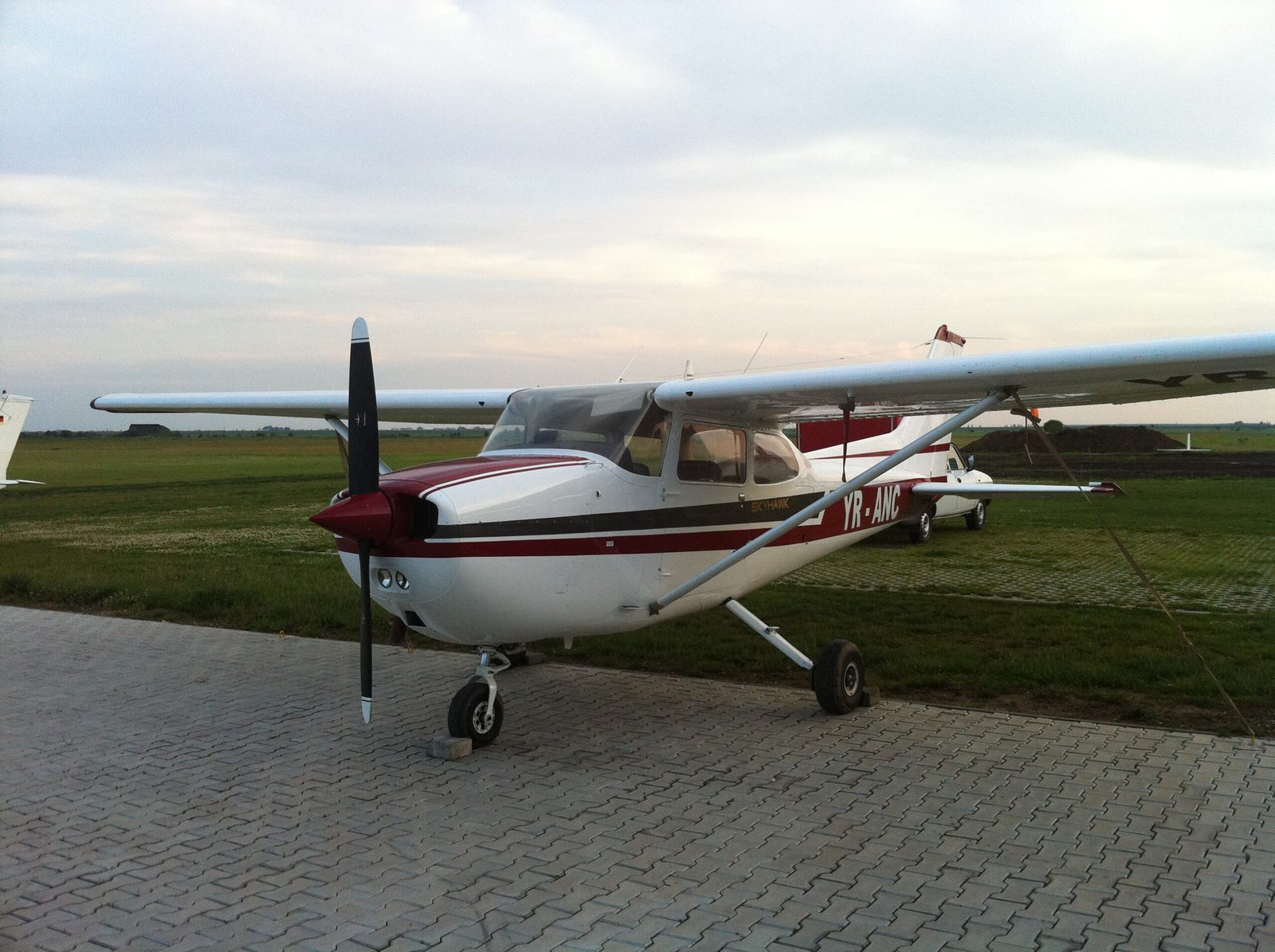 Cessna 172 training aircraft on the ramp at a flight school in Romania